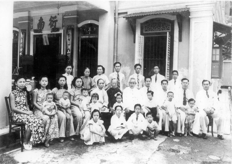 A 1940s Chinese New Year photo of Lam family members. Squatting in the forefront (first from right) is the writer