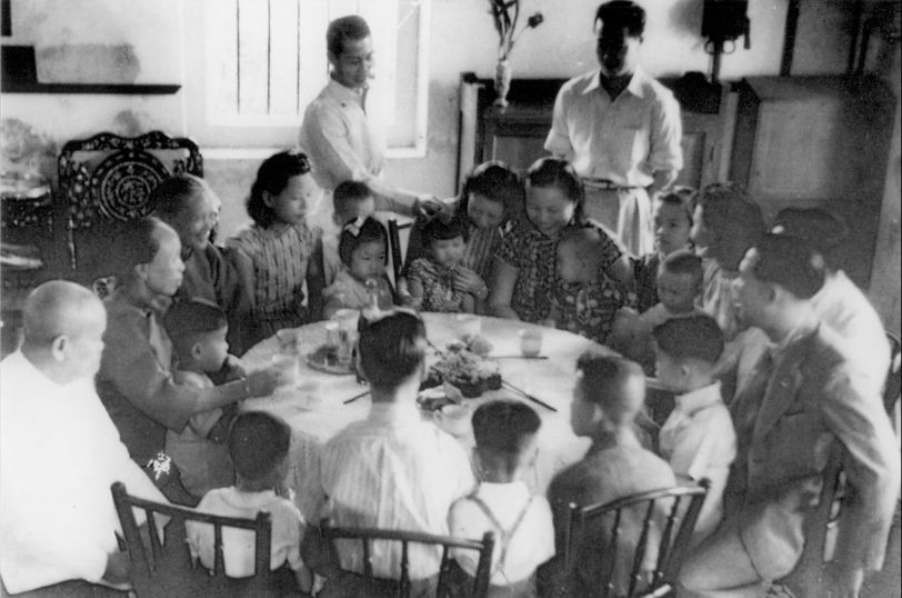 The Lam family having tea and Chinese New Year titbits in the early 1940s