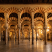Interior of Mosque-Cathedral of Córdoba with red and white striped arches and marble columns